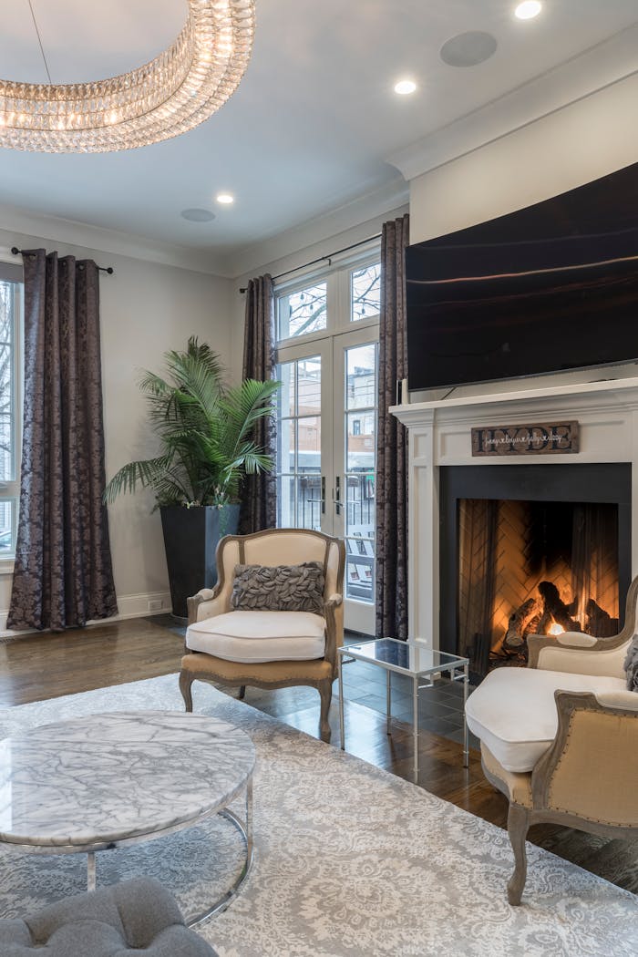creative-03 Cozy and stylish living room interior featuring a fireplace and modern decor.